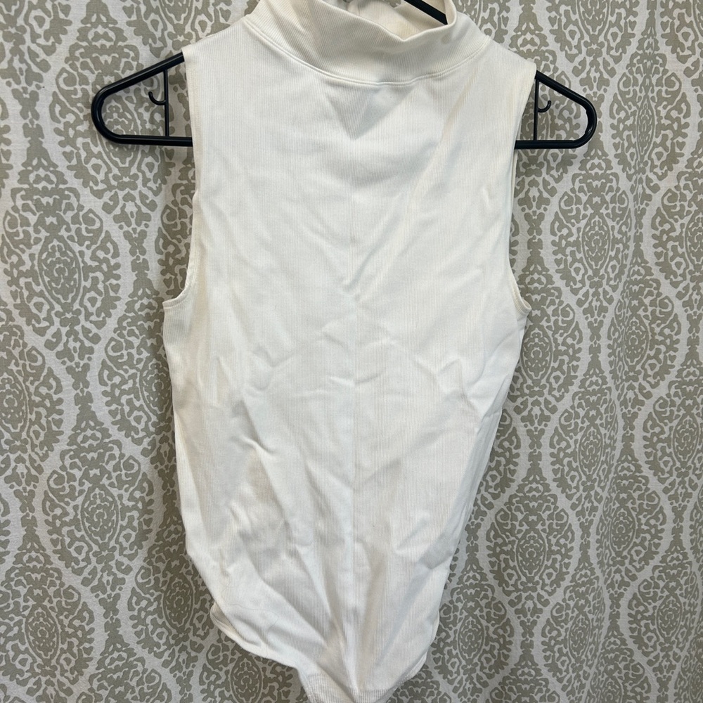 Sleeveless White Turtleneck Bodysuit